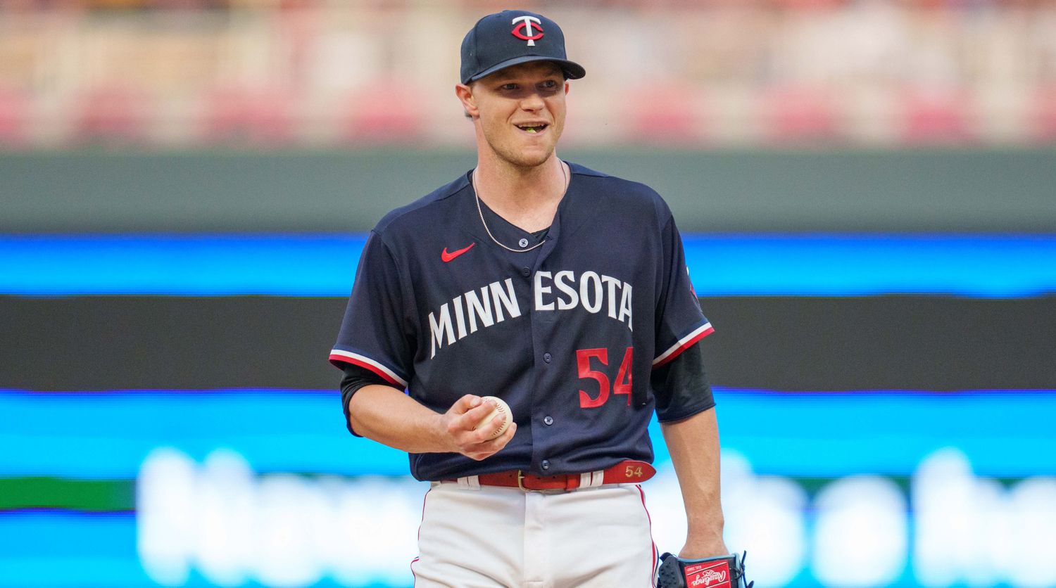 Minnesota Twins starting pitcher Sonny Gray holds the ball while smiling against the Chicago White Sox.